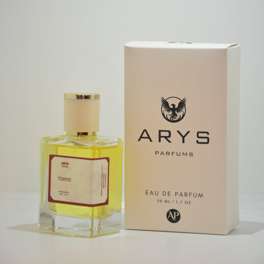A bottle of Arys Parfums Tokyo with pale yellow liquid and a cream cap, shown next to its beige packaging box on a plain white background. This is Tokyo, inspired by L'Eau d'Issey Pour Homme by Issey Miyake.