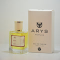 A bottle of Arys Parfums Tokyo with pale yellow liquid and a cream cap, shown next to its beige packaging box on a plain white background. This is Tokyo, inspired by L'Eau d'Issey Pour Homme by Issey Miyake.